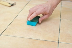 Spraying water on floor tiles Spraying water on floor tiles