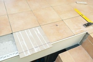 Marking tiles along metal edging