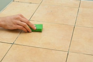 Cleaning tile with a sponge